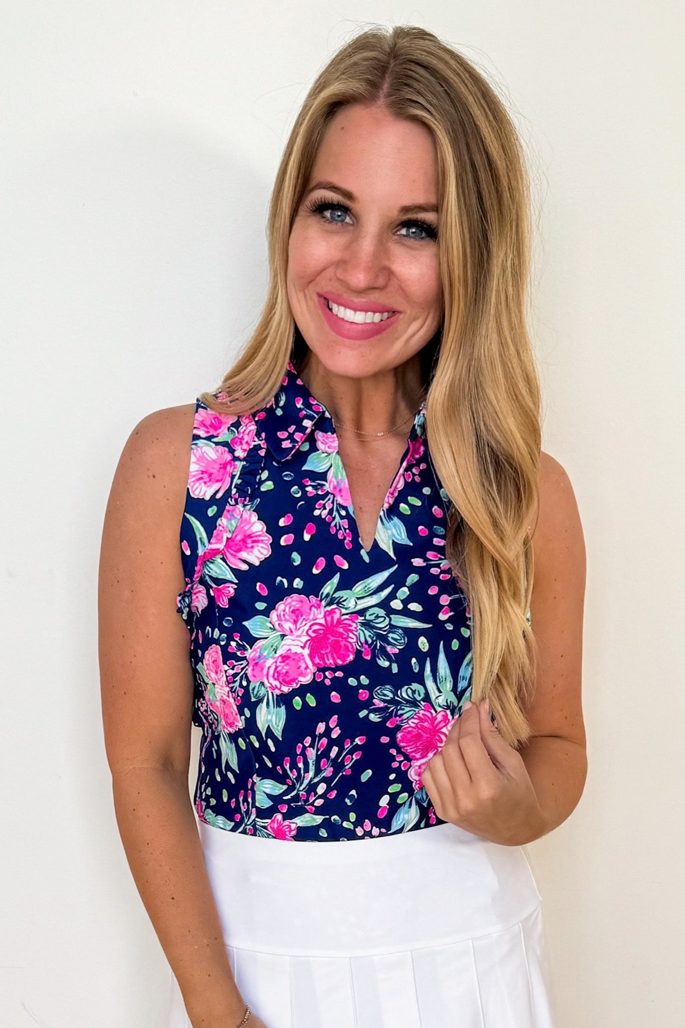 The Genesis Ruffle Polo Tank Top in Navy & Pink Floral