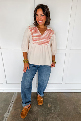 The Collared V-neck Smocked Embroidered Top in Cream