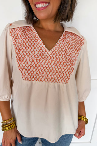 The Collared V-neck Smocked Embroidered Top in Cream