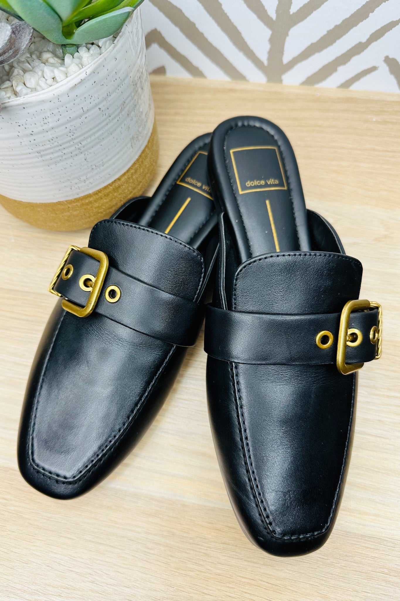 The Santel Black Leather Flat Mules by Dolce Vita