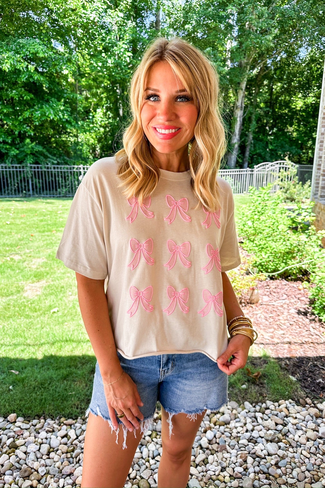 Pink Textured Bow Cropped Beige Graphic Tee