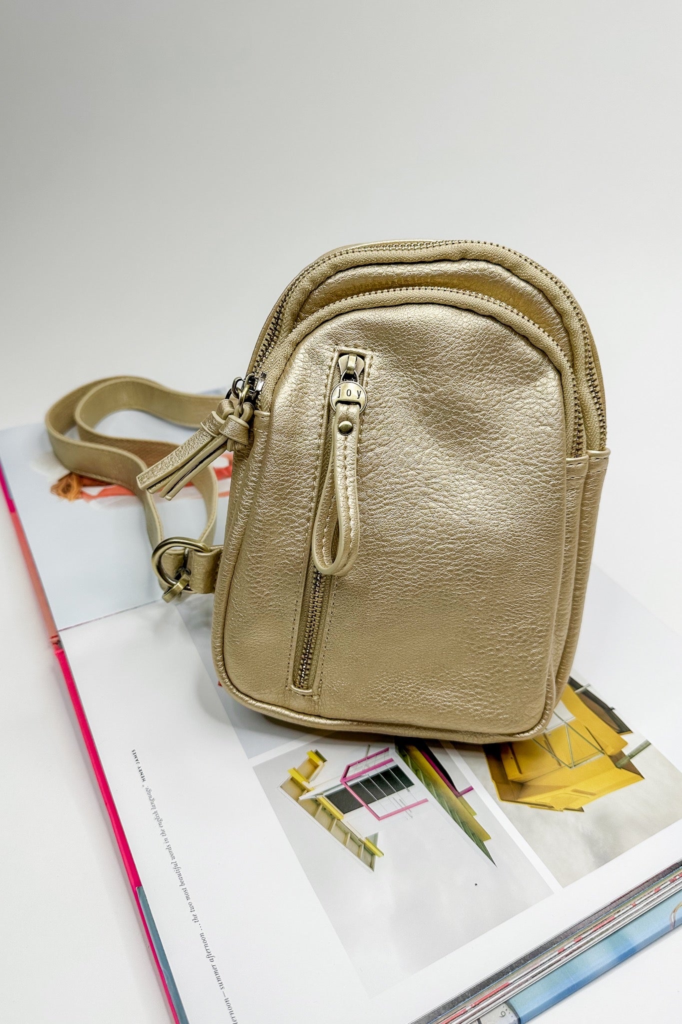 The Skyler Metallic Gold Sling Bag by Joy Susan