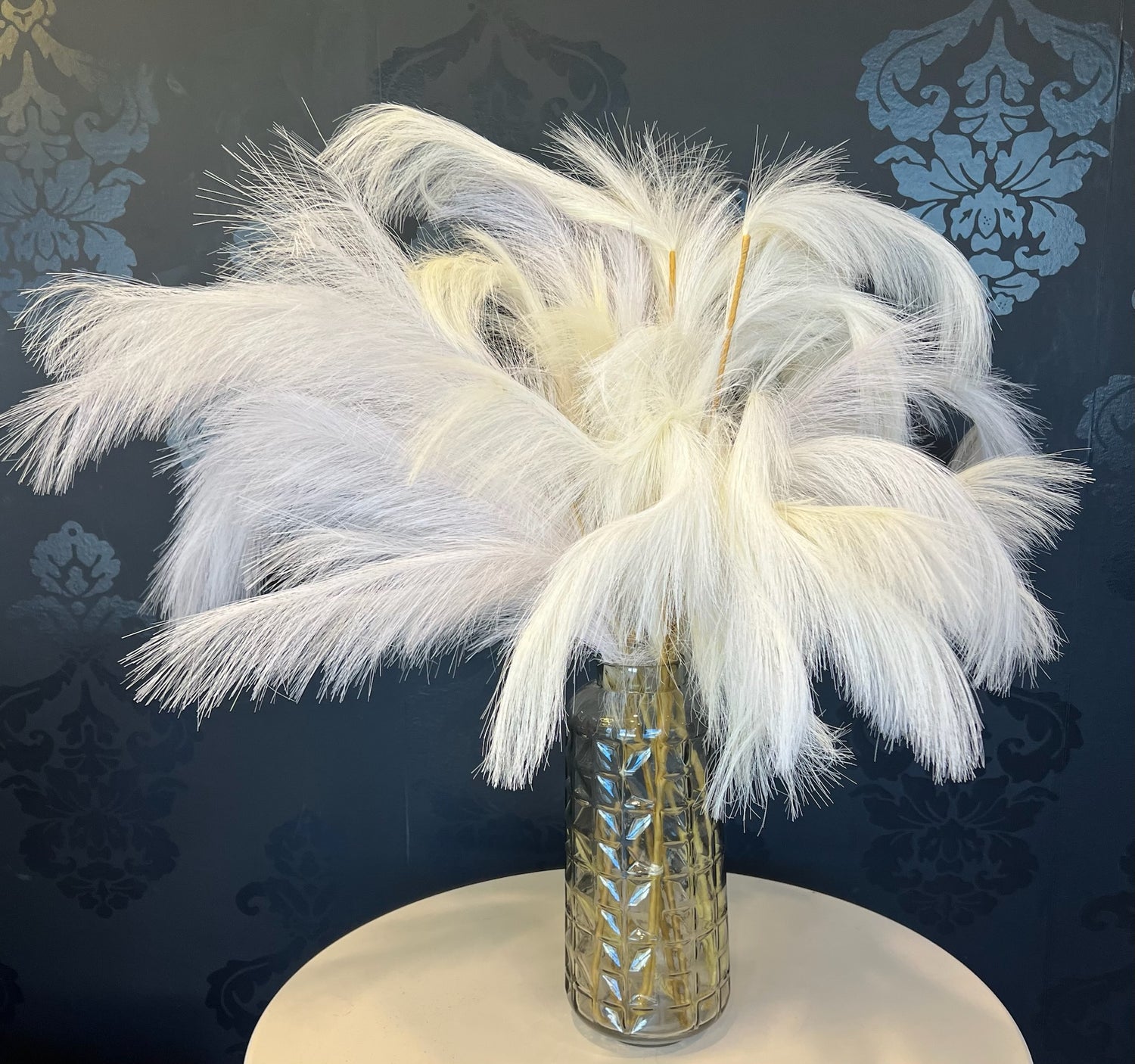 Clear Vase with White Feather Picks