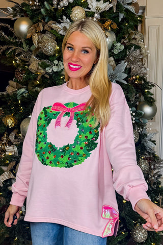 Put A Bow On It Wreath Sweatshirt by Brianna Cannon