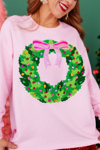 Put A Bow On It Wreath Sweatshirt by Brianna Cannon
